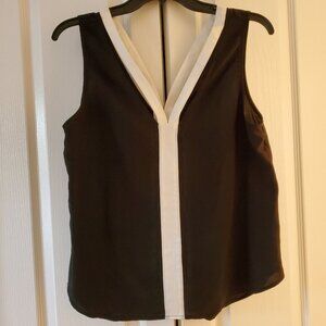 Trouve black camisole top with white trim along; size medium